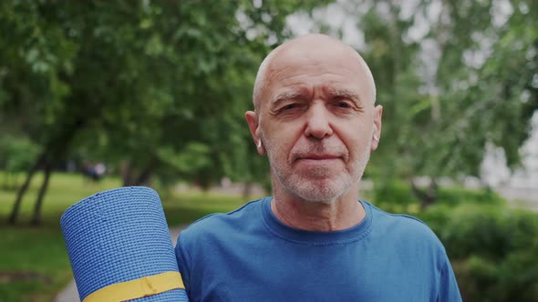 Closeup Portrait of Strong Old Man with Age Wrinkles