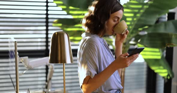 Woman During a Coffee Break at Home Office