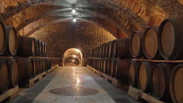 Old Wooden Barrels with Wine in the Ancient Medieval Cellars