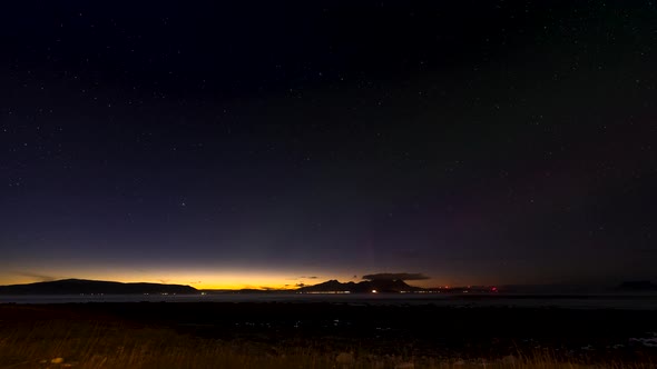 Aurora borealis light display in the Arctic, streaking green lights, time lapse