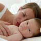 Mother and baby lying in bed - VideoHive Item for Sale