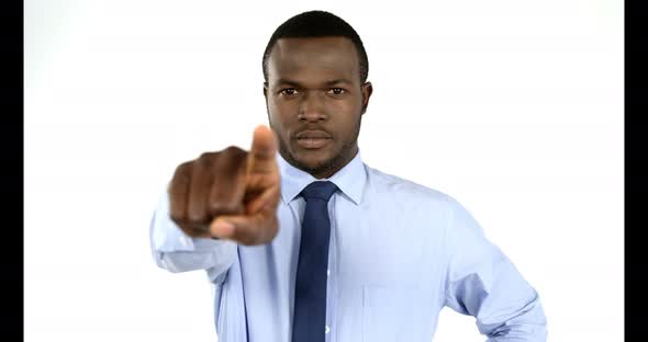 Portrait of businessman pointing