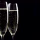 Two glasses of champagne with bubbles on black background - VideoHive Item for Sale