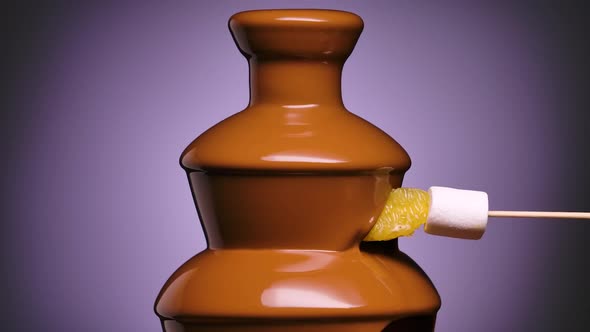 Melted Milk Chocolate Flows in Chocolate Fountain
