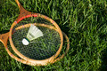 Tennis rackets and shuttlecock on the green grass - PhotoDune Item for Sale