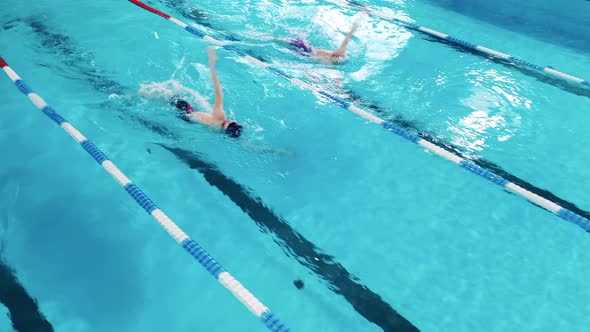 Sportsmen Swimming Using Breaststroke Technique