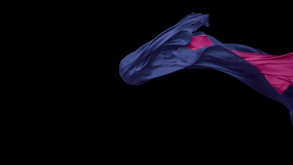 Blue and pink fabric flowing on black background, Slow Motion