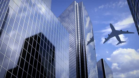 Airplane Flying Over Business Center