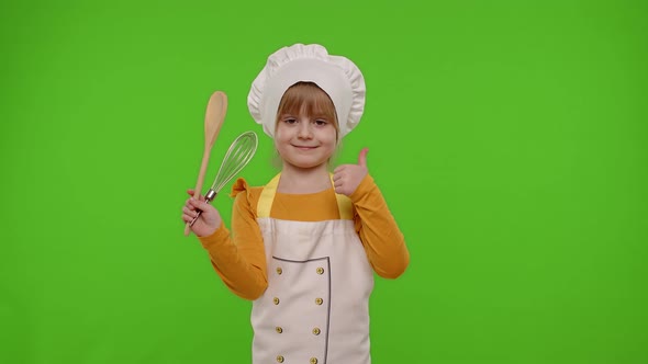 Child Girl Kid Cook Chef Baker Posing Smiling Showing Thumb Up on Green Chroma Key Background
