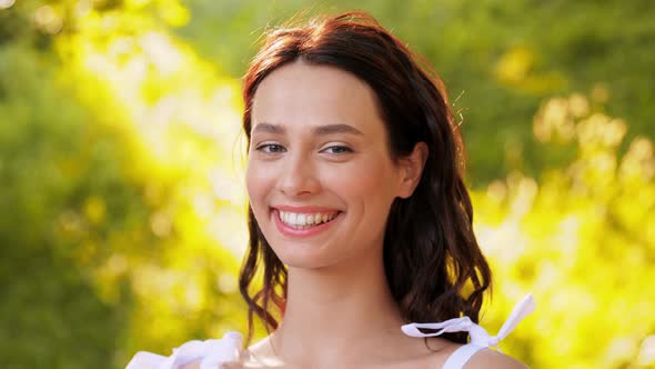 Portrait of Happy Smiling Woman at Summer Park