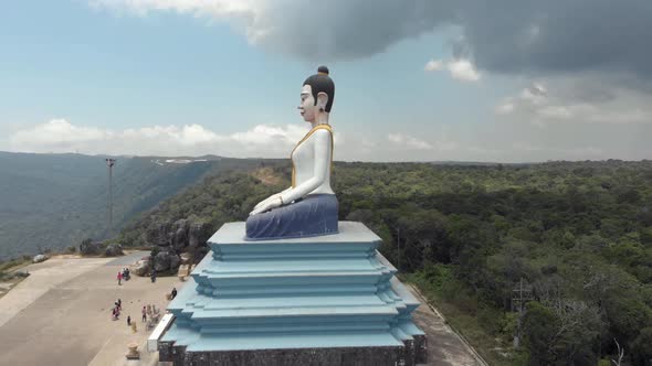 Big Statue of colourful sitting Buddha in the Bokor Mountains of Kampot, Cambodia