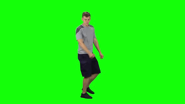 Guy Goes and Dances, Smiles and Rejoices on a Green screen.Profile Side View