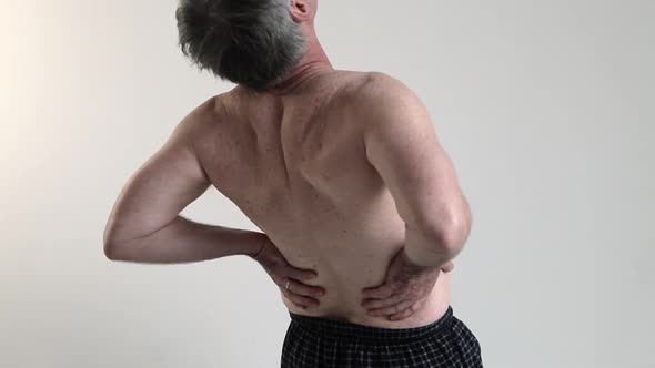 Man experiencing back pain
