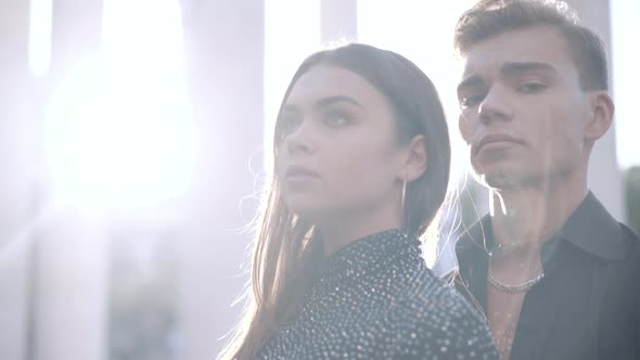 Closeup of Young Beautiful Caucasian Couple Standing in Sunlight Outdoors