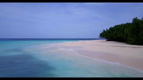 Aerial view seascape of luxury coast beach trip by turquoise sea with white sandy background of a da