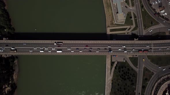 Drone's Eye View -  Aerial Car Driving on a Car Bridge.