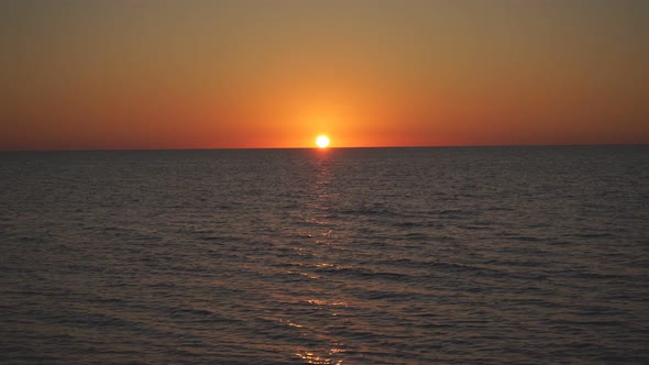 Beautiful Sunset on the Sea. Orange Sunset. Sunset with Sea View. Yellow-red Sun Going Into the Sea