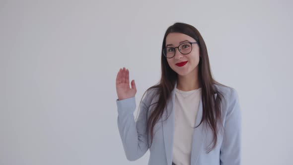 Ambitious Young Business Lady is Laughing and Shows Hand Gesture with Palm Up