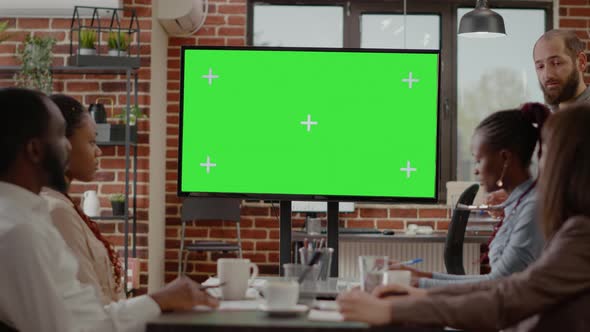 Man Doing Presentation with Isolated Green Screen on Display