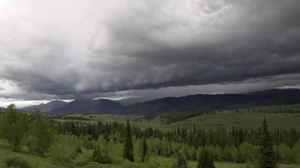 Time lapse of rain storm moving away over the mountain range