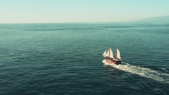 A Pirate Sailboat in the Open Ocean Rushes Towards Adventure