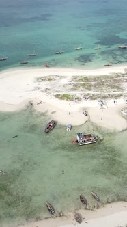 Vertical Video Boats in the Ocean Near the Coast of Zanzibar Tanzania