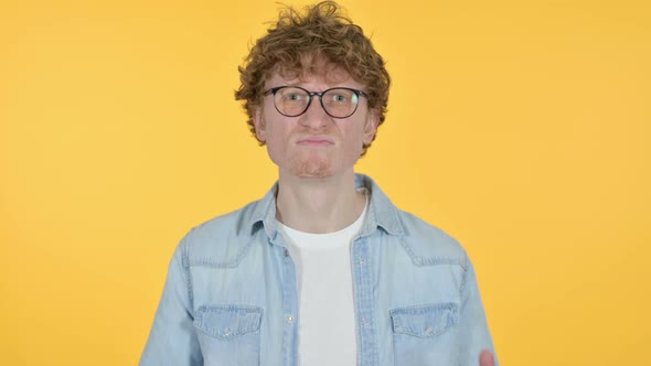 Disappointed Redhead Young Man Having Loss Yellow Background