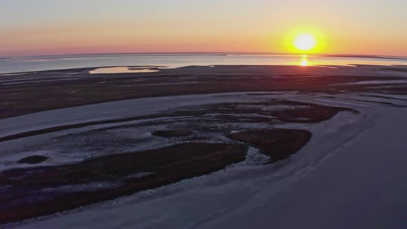 Sandy Swamp By a Beautiful Lake and Colorful Sunset