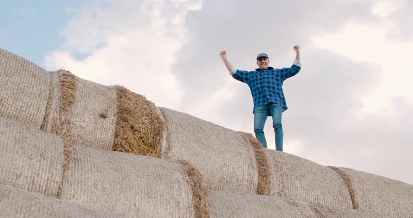 Successful Farming Concept, Positive Farmer Looking on Crops.