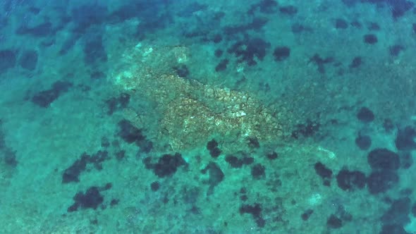 Small Islet Island Formed by the Accumulation of Rock Deposits Atop a Reef in the Sea