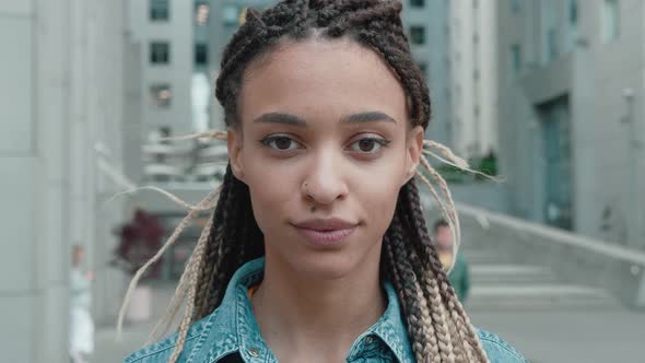 Portrait of Beautiful Stylish African American Woman With Dreadlocks Smiling At Camera With