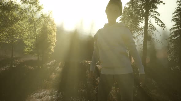 Young Woman Standing Alone Outdoor with Wild Forest Mountains alt