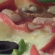 A pizza is cooking while it's rotating in the oven. Close up. - VideoHive Item for Sale