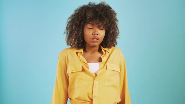 Darkskinned Woman Taking a Deep Breath Rolling Her Eyes and Showing Fed Up Hand Gesture Posing on