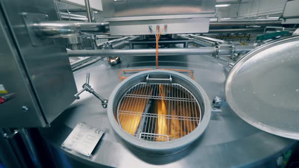 Cheese Production Process. Metal Cistern with Dairy Substance Getting Cooked in It