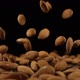 Almonds Fall Onto a Hard Black Surface - VideoHive Item for Sale