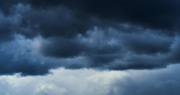 Footage Timelapse Sky and Black Cloud. Dark Grey Storm Clouds Dramatic Sky Dark Stormy Cloudy.