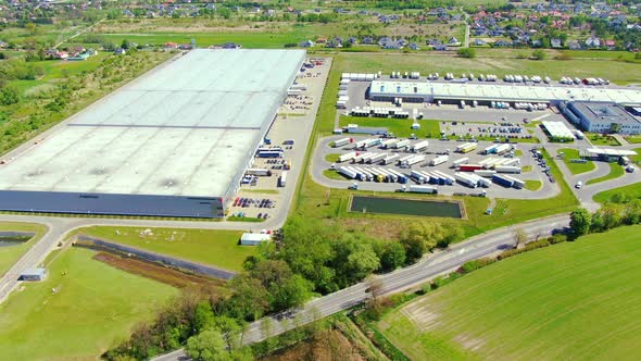 Aerial view of warehouse storages or industrial factory or logistics center from above. Top view of