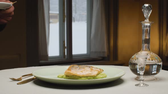 Chef Putting a Piece of Fish on a Plate