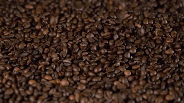 Aroma Roasted Coffee Beans Falling on a Pile