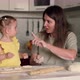 Cheerful Mom and Daughter While Cooking Baking at Home - VideoHive Item for Sale