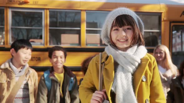 Girl by school bus