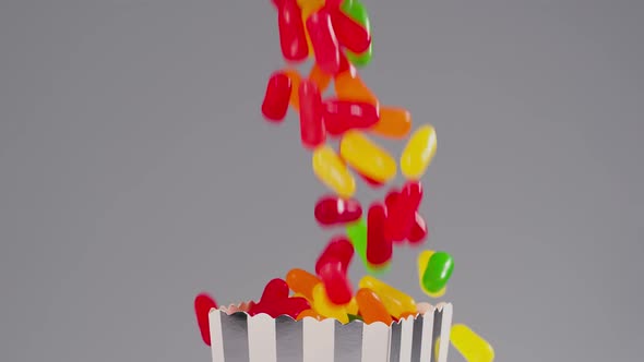 Colorful candy falls in slow motion