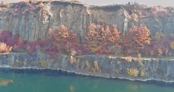 Stunning View of a Quarry Pond Formed After Mining Stones with Water That is Clear Turquoise in