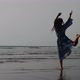 Silhouette of young girl dancing at sunset in slow motion - VideoHive Item for Sale