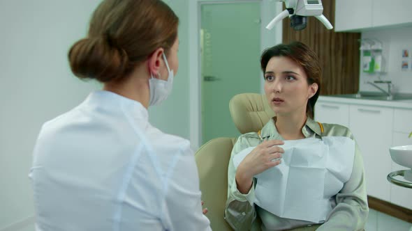 Girl Shows Something While Talking To the Dentist