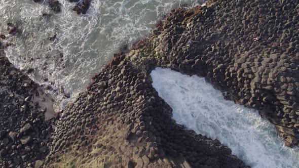 Sea Waves Breaking On Basalt Columns At Fingal Head Causeway In New South Wales, Australia. aerial d