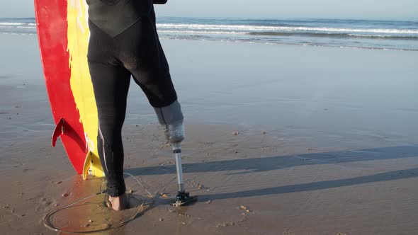 Medium Shot of Surfers Bionic Leg in Diving Suit