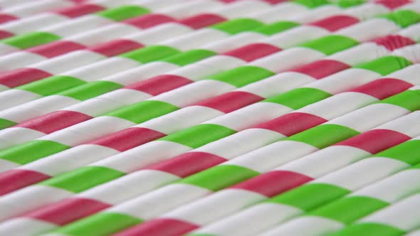 Biodegradable paper colored drinking straws. Flexible striped bright tubules. Eco recycling material