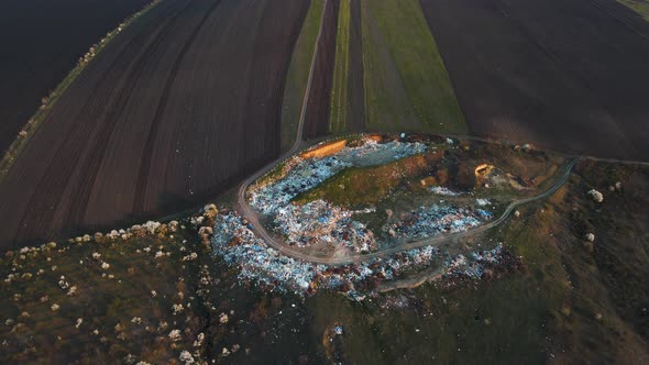 Aerial Drone View of Large Garbage Landfill Near Agricultural Land